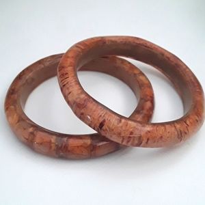 TWO POLISHED WOODEN BRACELETS